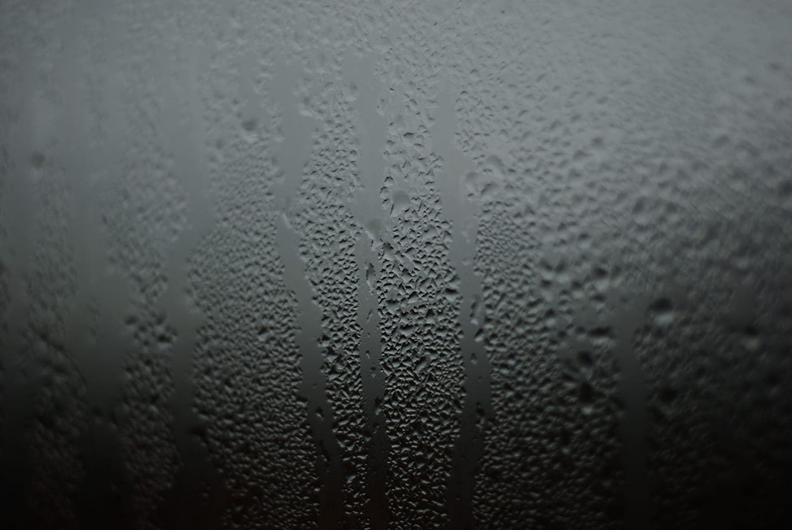 Heavy condensation running down the inside of a window pane